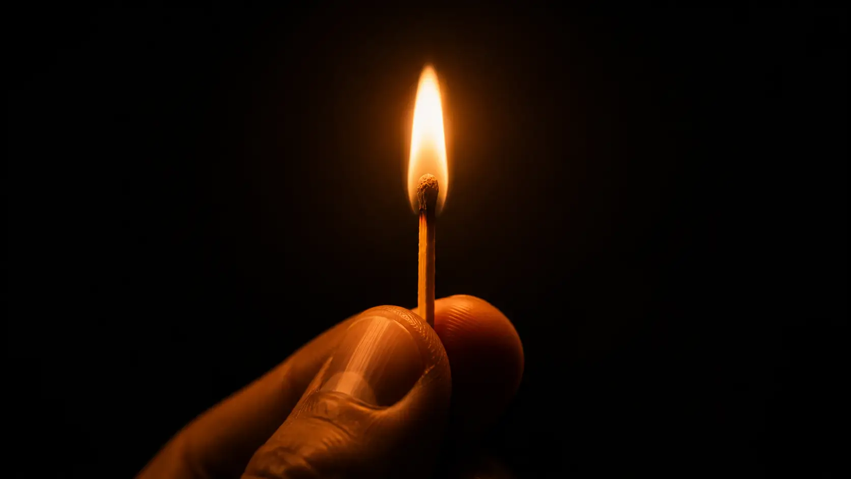 Offer clarity concept: a lit match in darkness representing precise, clear positioning